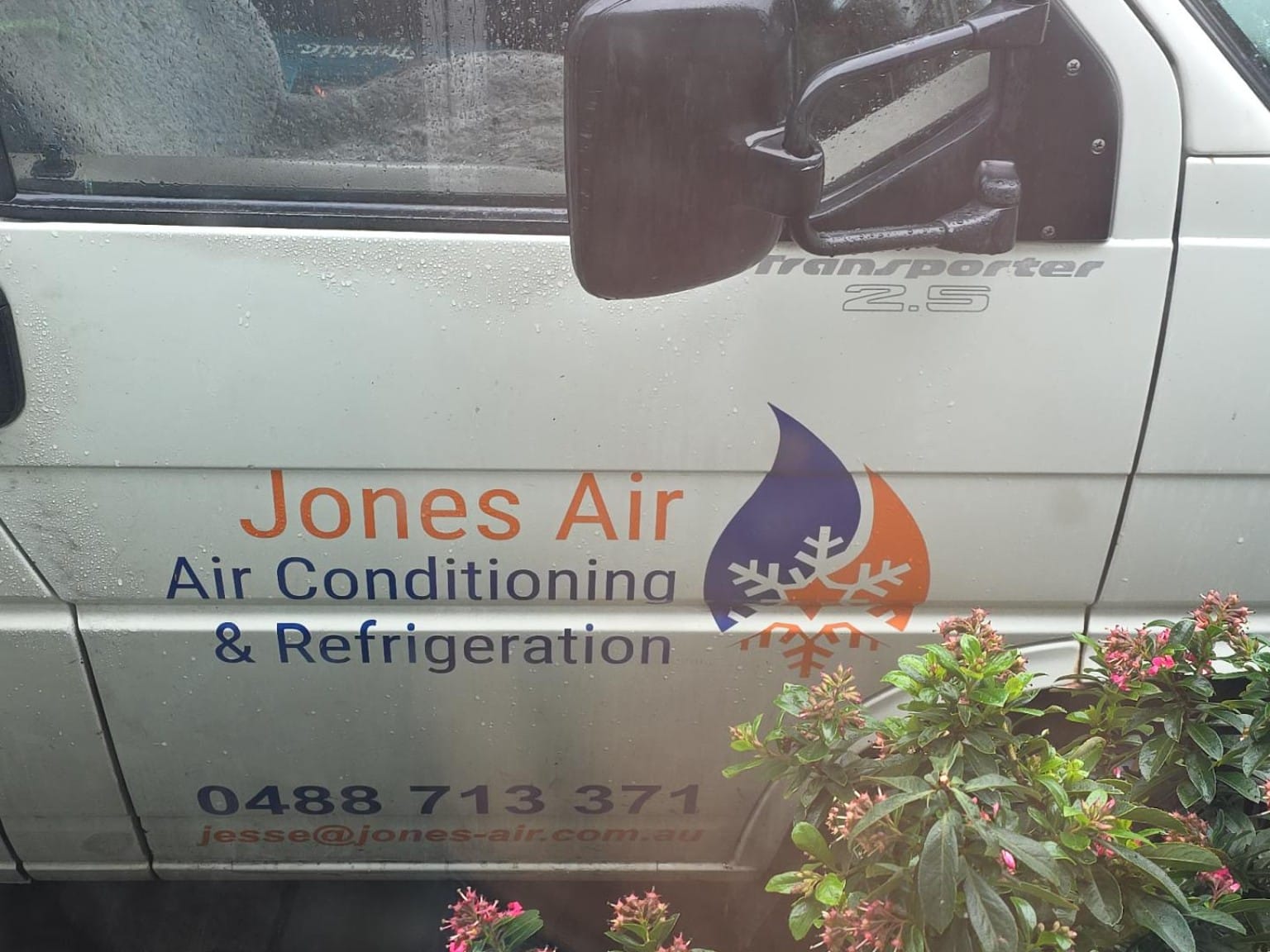 The Jones Air van door with the logo, name and phone number